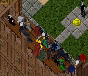 The Crowd and Referee Ga'kuct Pause to Examine the Bagball's Weight